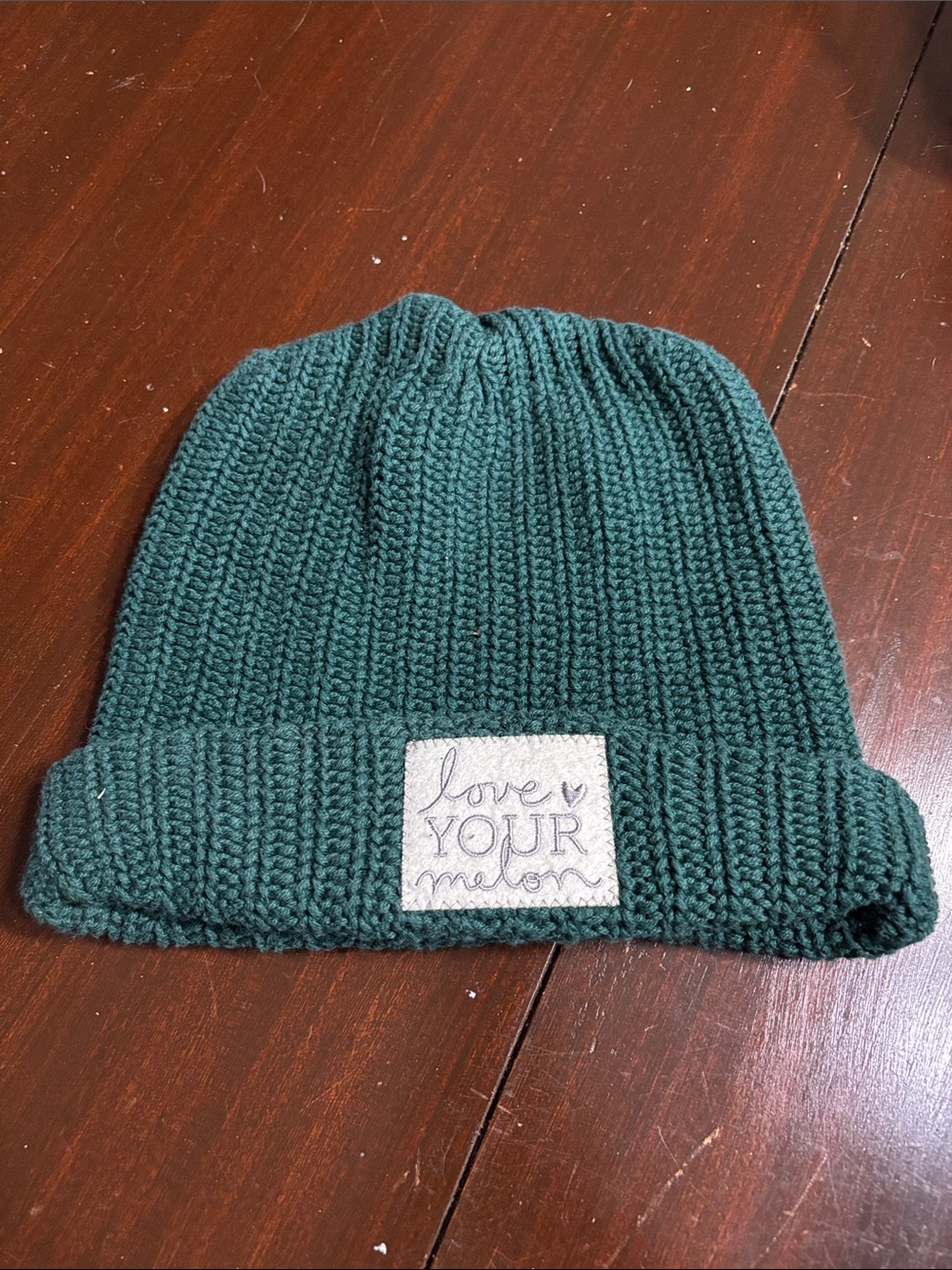 Love Your Melon Dark Green Knit Beanie with light gray felt Patch